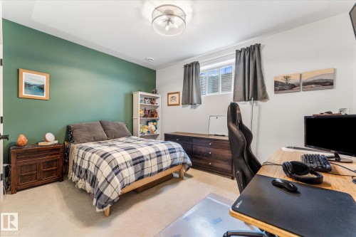Spacious room featuring a single window, recessed lighting, and a prominent accent wall - #52 Riverstone Close, Rural Sturgeon County, AB - Indoor Photo Showing Bedroom