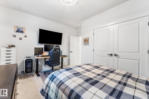 Neutral-toned carpeting and white walls create a bright interior - #52 Riverstone Close, Rural Sturgeon County, AB - Indoor Photo Showing Bedroom