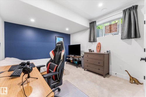 Carpeted room featuring a bold accent wall, recessed lighting, and a neutral color palette - #52 Riverstone Close, Rural Sturgeon County, AB - Indoor Photo Showing Office