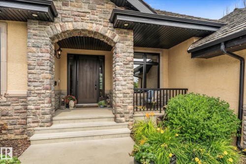 Stone masonry facade with an arched entryway - #52 Riverstone Close, Rural Sturgeon County, AB - Outdoor