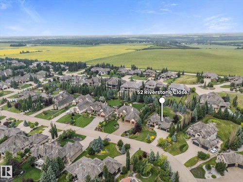 Aerial perspective showcasing a residential community with varied architectural styles - #52 Riverstone Close, Rural Sturgeon County, AB - Outdoor With View