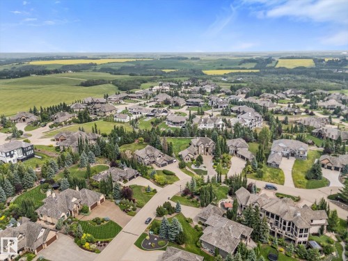 Expansive residential area featuring numerous large-scale homes with varied architectural styles - #52 Riverstone Close, Rural Sturgeon County, AB - Outdoor With View