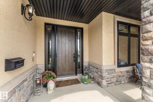 Stucco exterior with stone veneer accents - #52 Riverstone Close, Rural Sturgeon County, AB -  With Exterior