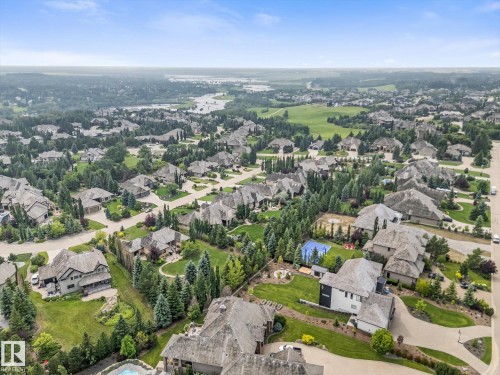 Expansive residential community featuring mature trees, manicured lawns, and diverse architectural styles - #52 Riverstone Close, Rural Sturgeon County, AB - Outdoor With View