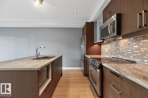 #405 10388 105 St Nw, Edmonton, AB - Indoor Photo Showing Kitchen With Double Sink With Upgraded Kitchen