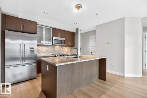 #405 10388 105 St Nw, Edmonton, AB - Indoor Photo Showing Kitchen With Stainless Steel Kitchen With Upgraded Kitchen