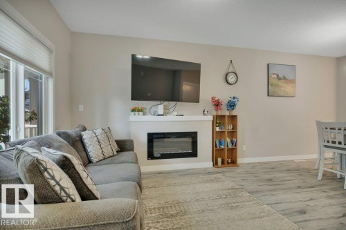 729 Berg Loop, Leduc, AB - Indoor Photo Showing Living Room With Fireplace