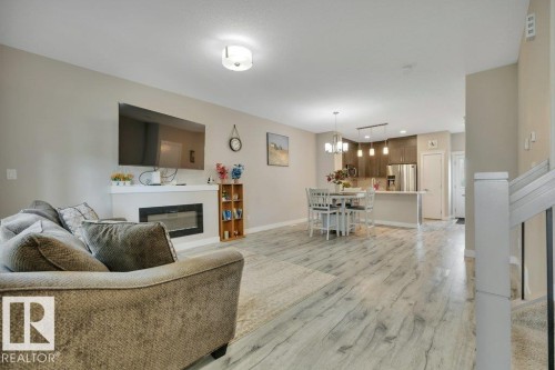 729 Berg Loop, Leduc, AB - Indoor Photo Showing Living Room With Fireplace