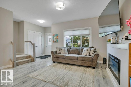 729 Berg Loop, Leduc, AB - Indoor Photo Showing Living Room With Fireplace