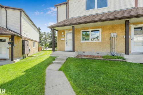 Concrete walkway leading to a covered entry with concrete steps - #39 14511 52 Street Nw, Edmonton, AB - Outdoor With Exterior