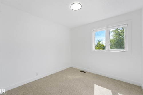 Room featuring a light-colored carpet, white walls, and a window with white trim - #39 14511 52 Street Nw, Edmonton, AB - Indoor Photo Showing Other Room