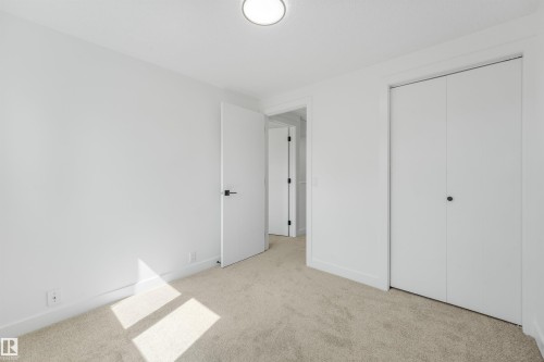 Clean interior space featuring light-toned carpeting and a neutral color palette - #39 14511 52 Street Nw, Edmonton, AB - Indoor Photo Showing Other Room