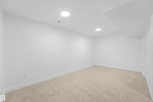 Carpeted room featuring white walls and recessed ceiling lighting - #39 14511 52 Street Nw, Edmonton, AB - Indoor Photo Showing Other Room