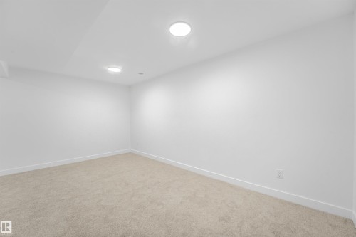 Carpeted room featuring recessed lighting, white walls, and white baseboards - #39 14511 52 Street Nw, Edmonton, AB - Indoor Photo Showing Other Room