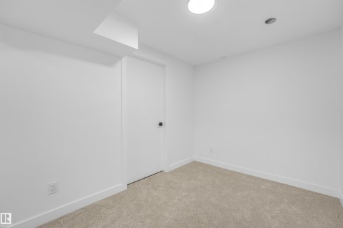 Neutral tone carpet flooring - #39 14511 52 Street Nw, Edmonton, AB - Indoor Photo Showing Other Room