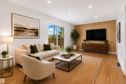 Recessed lighting, wood-finish flooring, a feature wall with vertical wood paneling, and a sliding glass door providing access to the exterior - 