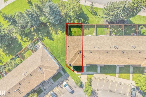 Townhome with a brown shingle roof and a private fenced yard - #39 14511 52 Street Nw, Edmonton, AB - 