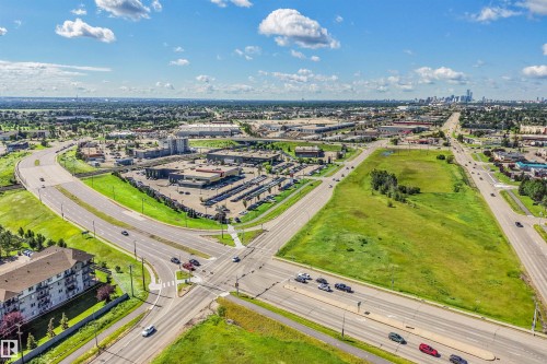 Expansive land parcel featuring existing roadways and visible commercial developments - #39 14511 52 Street Nw, Edmonton, AB - Outdoor With View
