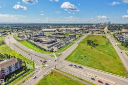 Expansive land parcel featuring existing roadways and visible commercial developments - 