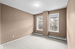 Neutral-toned walls complement the light-colored carpeting - 