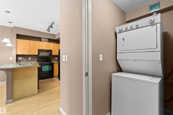 Integrated laundry area with a stacked washer and dryer unit - 