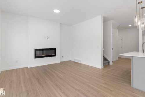 913 19 Avenue Nw, Edmonton, AB - Indoor Photo Showing Living Room With Fireplace