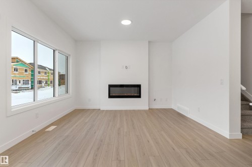 913 19 Avenue Nw, Edmonton, AB - Indoor Photo Showing Other Room With Fireplace