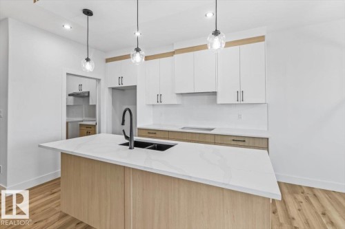 25 Foxtail Road, Fort Saskatchewan, AB - Indoor Photo Showing Kitchen With Double Sink With Upgraded Kitchen
