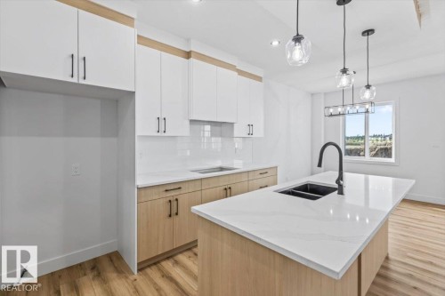 25 Foxtail Road, Fort Saskatchewan, AB - Indoor Photo Showing Kitchen With Double Sink With Upgraded Kitchen