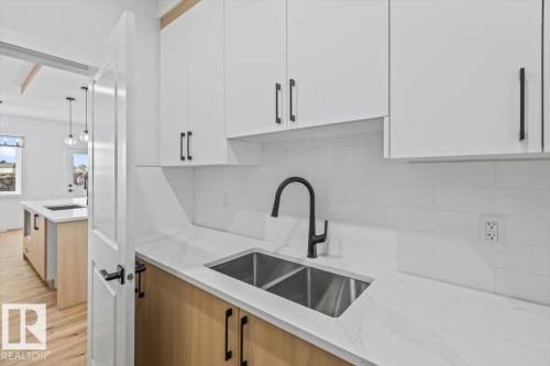 25 Foxtail Road, Fort Saskatchewan, AB - Indoor Photo Showing Kitchen With Double Sink