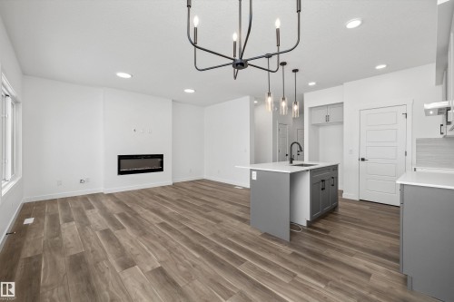 18931 28 Avenue Nw, Edmonton, AB - Indoor Photo Showing Kitchen With Fireplace