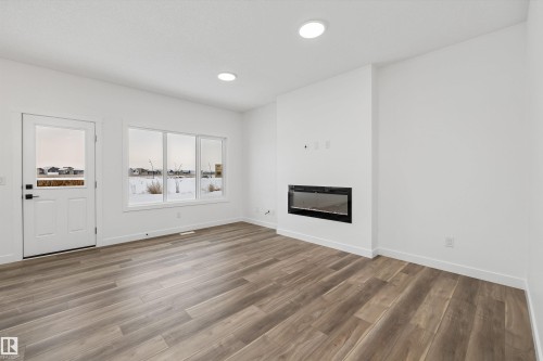 18931 28 Avenue Nw, Edmonton, AB - Indoor Photo Showing Other Room With Fireplace