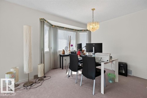 Room featuring a bay window, light-colored walls, and neutral carpeting - 1046 Jones Crescent Nw, Edmonton, AB - Indoor Photo Showing Office