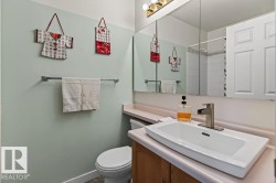 Bathroom featuring a rectangular vessel sink with a single-handle brushed nickel faucet - 