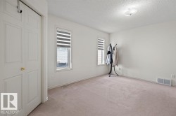 Neutral wall tones with soft carpeting - 