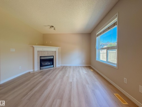 976 Rutherford Road Sw, Edmonton, AB - Indoor Photo Showing Living Room With Fireplace