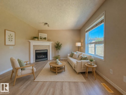 976 Rutherford Road Sw, Edmonton, AB - Indoor Photo Showing Living Room With Fireplace