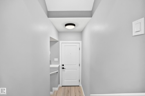 separate entrance towards Basement - 38 Avonlea Way, Spruce Grove, AB - Indoor Photo Showing Other Room