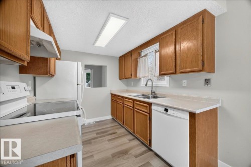 #23 10453 20 Av Nw, Edmonton, AB - Indoor Photo Showing Kitchen With Double Sink