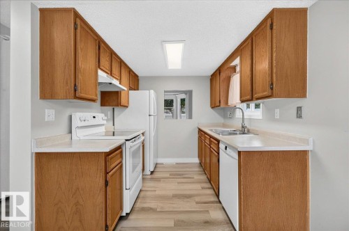 #23 10453 20 Av Nw, Edmonton, AB - Indoor Photo Showing Kitchen With Double Sink