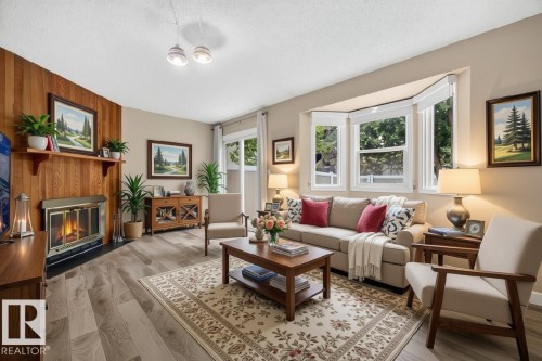 #23 10453 20 Av Nw, Edmonton, AB - Indoor Photo Showing Living Room With Fireplace