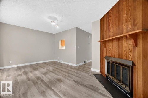 #23 10453 20 Av Nw, Edmonton, AB - Indoor Photo Showing Other Room With Fireplace