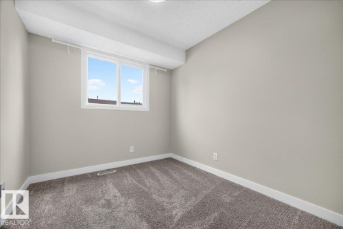 #23 10453 20 Av Nw, Edmonton, AB - Indoor Photo Showing Other Room