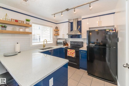 #13 7289 South Terwillegar Dr Nw, Edmonton, AB - Indoor Photo Showing Kitchen With Double Sink