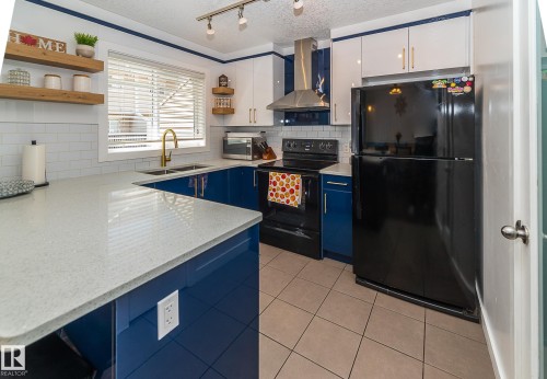 #13 7289 South Terwillegar Dr Nw, Edmonton, AB - Indoor Photo Showing Kitchen With Double Sink