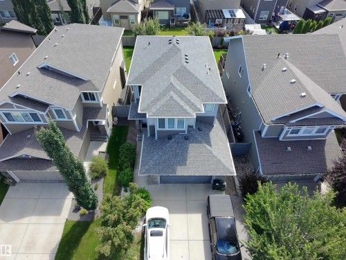 Aerial perspective showcasing a two-story residence with a multi-gabled roofline - 8719 218 Street Nw, Edmonton, AB - Outdoor