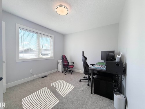 Room with light gray walls and plush gray carpeting - 8719 218 Street Nw, Edmonton, AB - Indoor Photo Showing Office