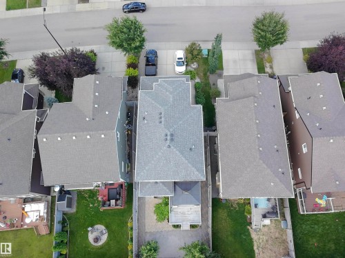 Gable roofline with multiple vents and a paved driveway - 8719 218 Street Nw, Edmonton, AB - Outdoor