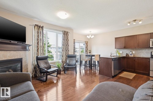 #12 18230 104A St Nw, Edmonton, AB - Indoor Photo Showing Other Room With Fireplace