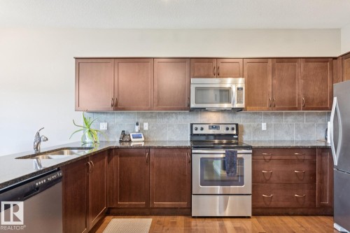 #12 18230 104A St Nw, Edmonton, AB - Indoor Photo Showing Kitchen With Double Sink